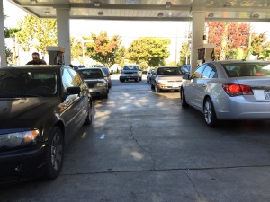 Drivers wait in long lines for best gas prices.