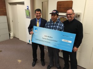 From left, PG&E's Rob Morse, student Julio Medina and Hartnell College President Willard LeWallen during the surprise announcement that Medina is the winner of a $20,000-a-year PG&E Bright Minds scholarship.